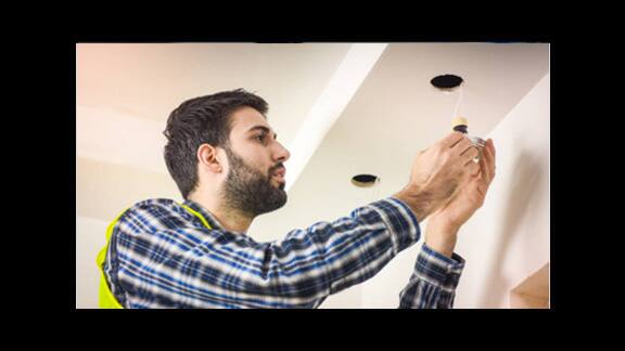 man installing bulb